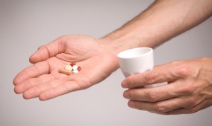 Giving pills to patient. Photo with clipping path.